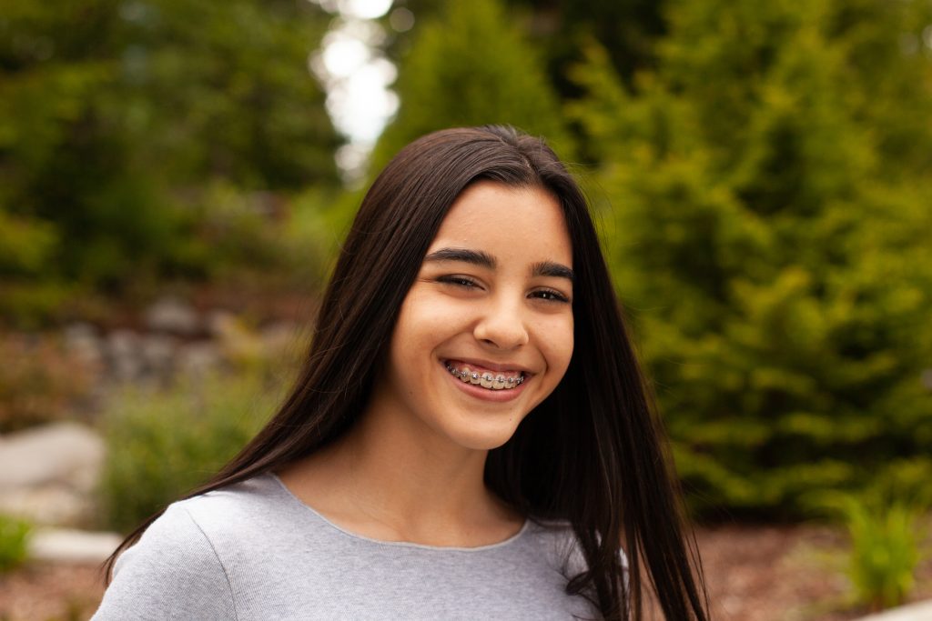 Girl with braces smiling
