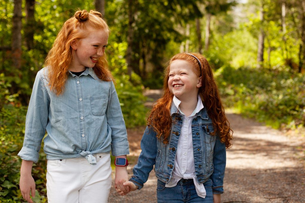 Early Orthodontic care for two girls holding hands