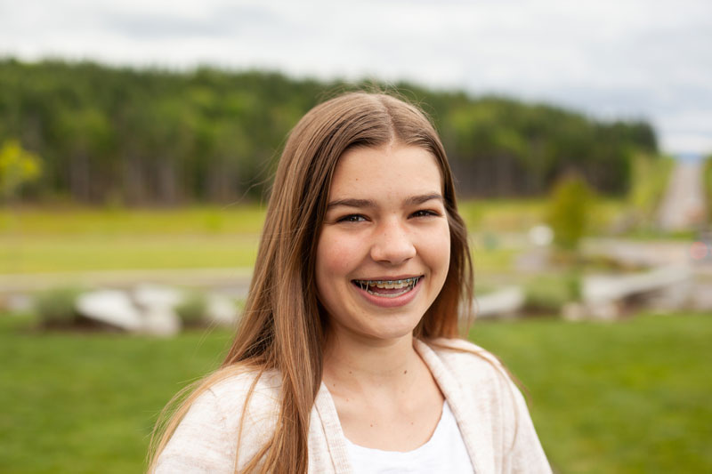 girl with braces smiling