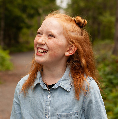 Girl with red hair smiling