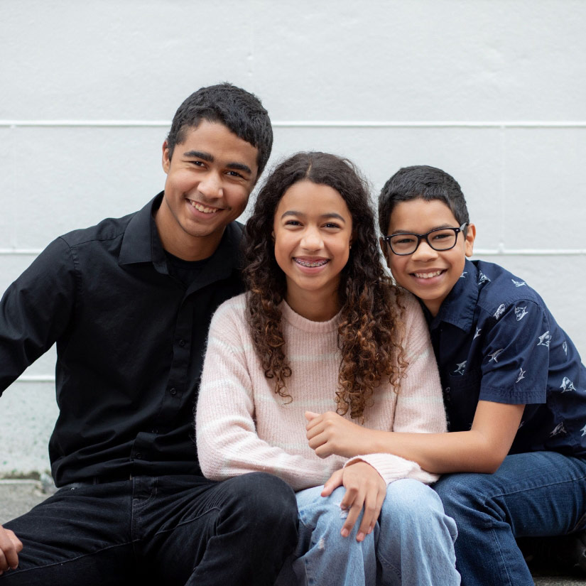 three kids smiling