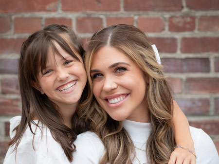 mother and daughter smiling