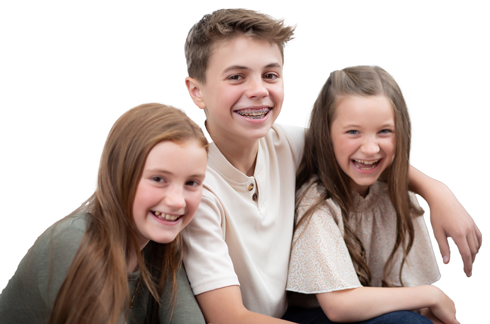 three kids with one with braces